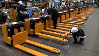 Process of Making an Electric Fork Pallet Truck. Logistics Equipment Factory in Korea.