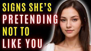 10 Signs She's Pretending Not To Like You (Reverse Psychology)