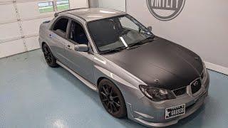 Subaru hood wrapped in Hexis Satin deep black vinyl wrap before and after.