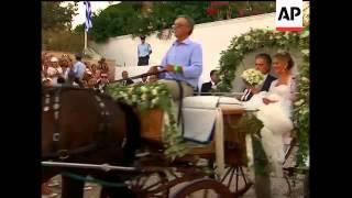 Bride and groom leave church, guests gathering