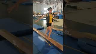 Front walkover on low beam