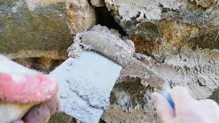 consolidation of a stone wall with haired lime mortar.