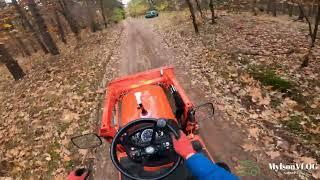 POV mini Tractor Forest drive in rainy day Kubota BX231 witch front loader