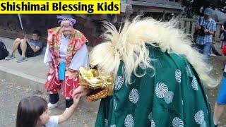 Kids getting blessings from Shishimai - Japanese Lion | Tokyo