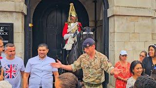 SOLDIER TELLS SMIRKING IDIOTS TO GET BACK AND GIVE THE HORSE SOME SPACE at Horse Guards!