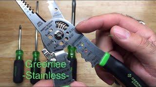 A few Greenlee tools wire strippers, screwdrivers, bottle opener