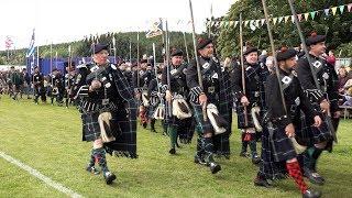 Lonach Highlanders arrive at the 177th Lonach Highland Games in Strathdon, Scotland, Aug' 2018