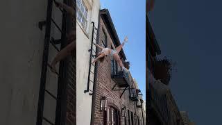 HUMAN FLAG ON A BUILDING