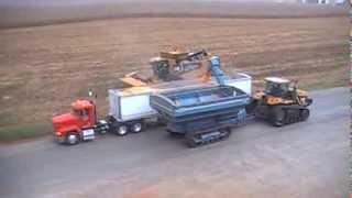 Caterpillar 595R Lexion Combine Harvesting Corn in the Rain