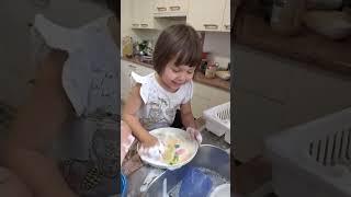 My Daughter washing dishes