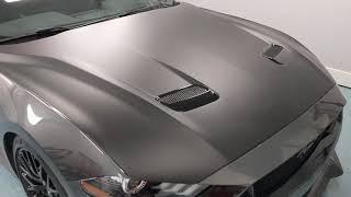 Hexis Satin Deep Black on hood of Ford Mustang short video.