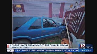 SUV goes over embankment, through building in Beverly