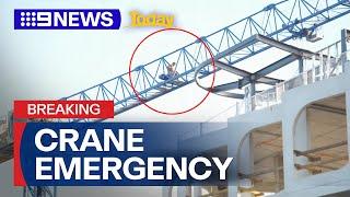 Man scales crane at construction site in Melbourne | 9 News Australia