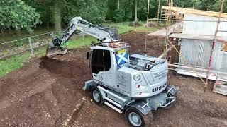 Liebherr A914 Compact on a housing site