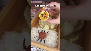 Stinky bento with angry face eggs