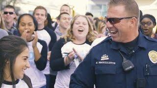 Massive mob overwhelms school's favorite police officer!