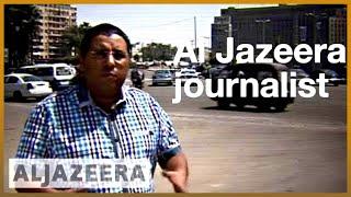  Why is Egypt continuing to hold Mahmoud Hussein without charge? | Al Jazeera English