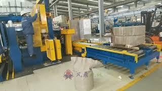 Automatic coil wrapping machine with 90 degree coil upender at the coil packing line