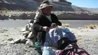 Old lady spinning wool