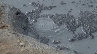 Seltun Geothermal area near Krisuvik, Iceland, showing bubbling and boiling mud and water, and st...