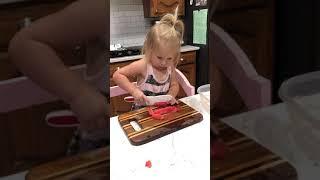 Reese Cutting Watermelon June 2021