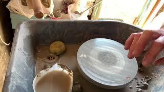 Throwing bowls on a kick wheel