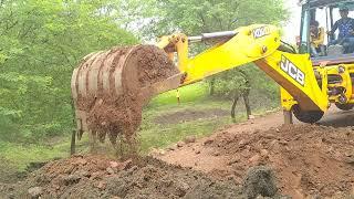 JCB machine video JCB Lifting Heavy Concrete Pipe and installing on Drain - JCB Backhoe Making Road