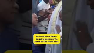 Priest kneels down to beg Governor