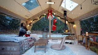 Snowy white Christmas camping in a cozy air tent