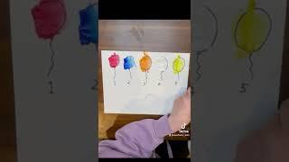 Colorful ballon numbers by 3 yr old boy + mom