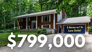 Sold! Inside this 5 acre $799,000 home, nestled amongst the trees with its own in-law suite!