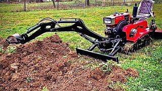 Crawler garden tractor with a backhoe