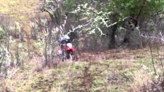 Honda 250 XR muddy hillclimb with Michael