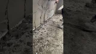 getting the sand and cement render on the concrete block walls