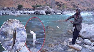 dharme brother taking fish trap from the river with fish and having family lunch