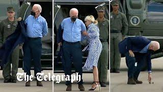 Joe Biden struggles to get his jacket on before dropping his sunglasses