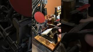 Letterpress printing red prints of Santa Claus