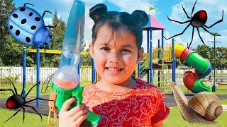 VACUUM BUG HUNT IN THE PLAYGROUND WITH ZOE SPIDERS PILL BUGS!
