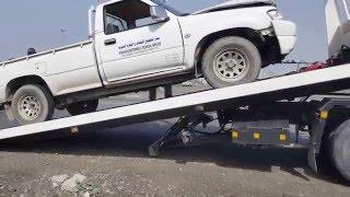 Recovery van lifting damaged vehicle in UAE