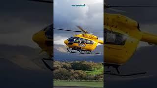 Air Ambulance (G-EMSS), lifting off from Ysbyty Gwynedd Hospital, Bangor, North Wales.