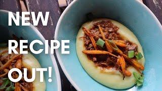 Savory lamb stew with fluffy mashed potatoes and roasted carrots