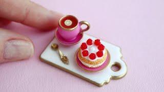 Miniature cup and cake with raspberriesPolymer clay