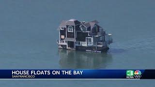 Entire house is seen floating on San Francisco Bay