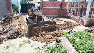 Start new project by Bulldozer MITSUBISHI project, push sand into the ground to build a house Villa.