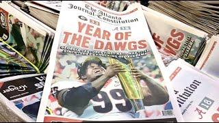 Fans get their UGA souvenir editions of The Atlanta Journal-Constitution