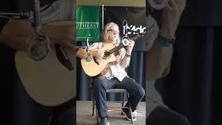 Tim Sparks playing Tellier guitars Koa OM at the Great River guitar show