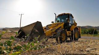 Backhoe Operator Going To Leveling Ground