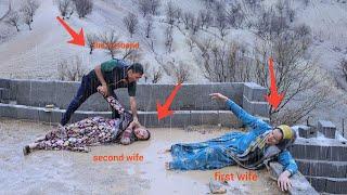 The second wife attacks the first wife in heavy rain and the husband throws the second wife out.