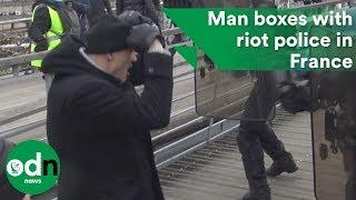 Man boxes with riot police in France