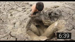 Find Catfish in Secret Hole Dry By Smart Boy -Boy Catching Giant Big Fish By Mud In The Dry Season